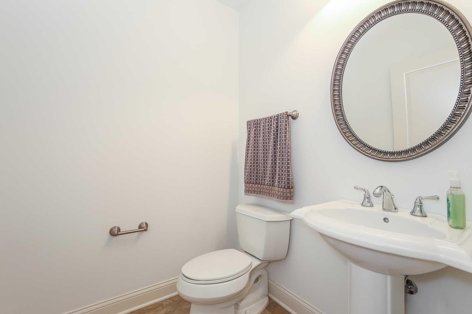 1000 Village Center Drive, Unit 312 Burr Ridge, IL 60527 - Photo 19 of 25 a bathroom with a sink and a mirror