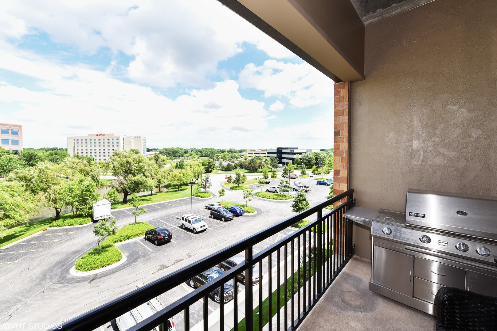 1000 Village Center Drive, Unit 312 Burr Ridge, IL 60527 - Photo 23 of 25 a view of a balcony dining table and chairs