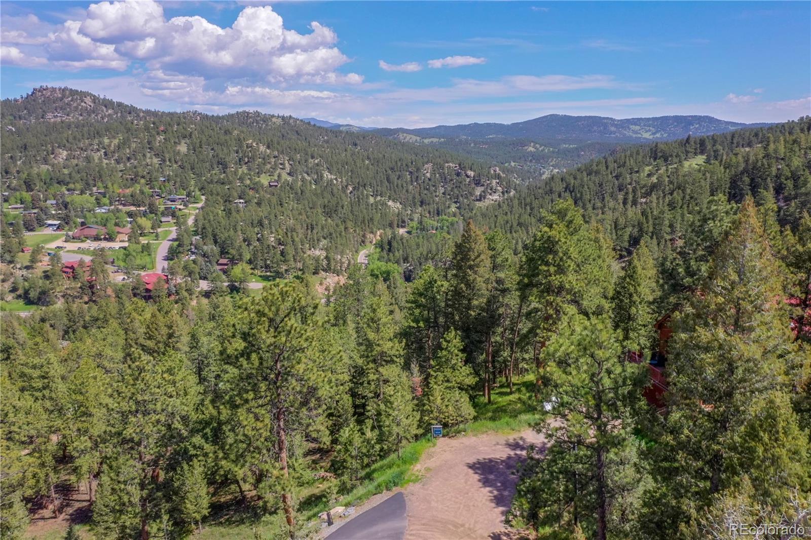4465 Forest Trail Evergreen, CO 80439 - Photo 12 of 19 a view of a city with mountain