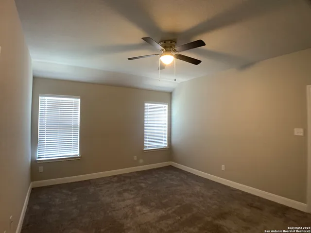 a view of empty room with windows