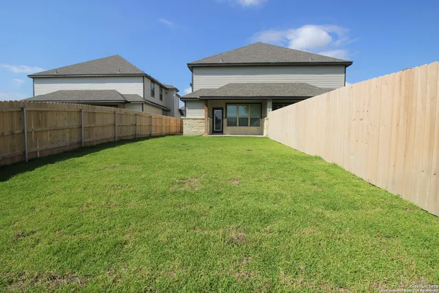a view of backyard of house