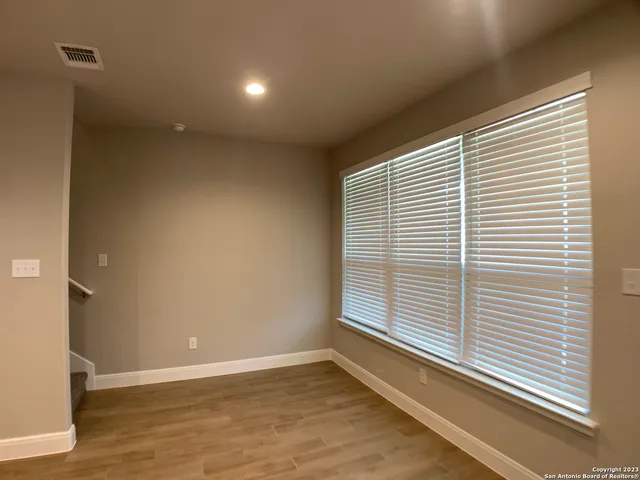 a view of a room that has a window in it