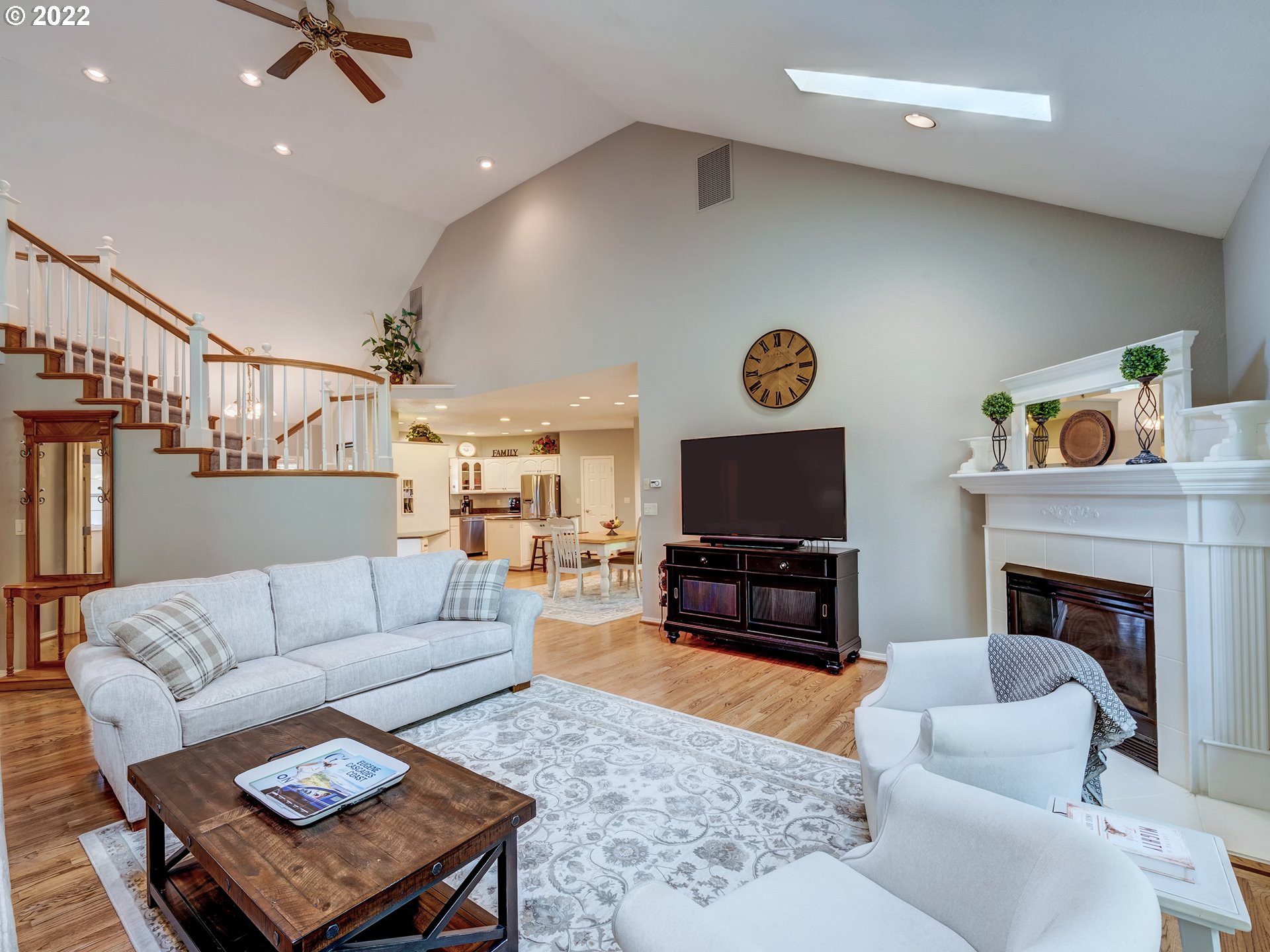 28244 Edgewater Drive Eugene, OR 97402 - Photo 14 of 30 a living room with furniture a flat screen tv and a fireplace