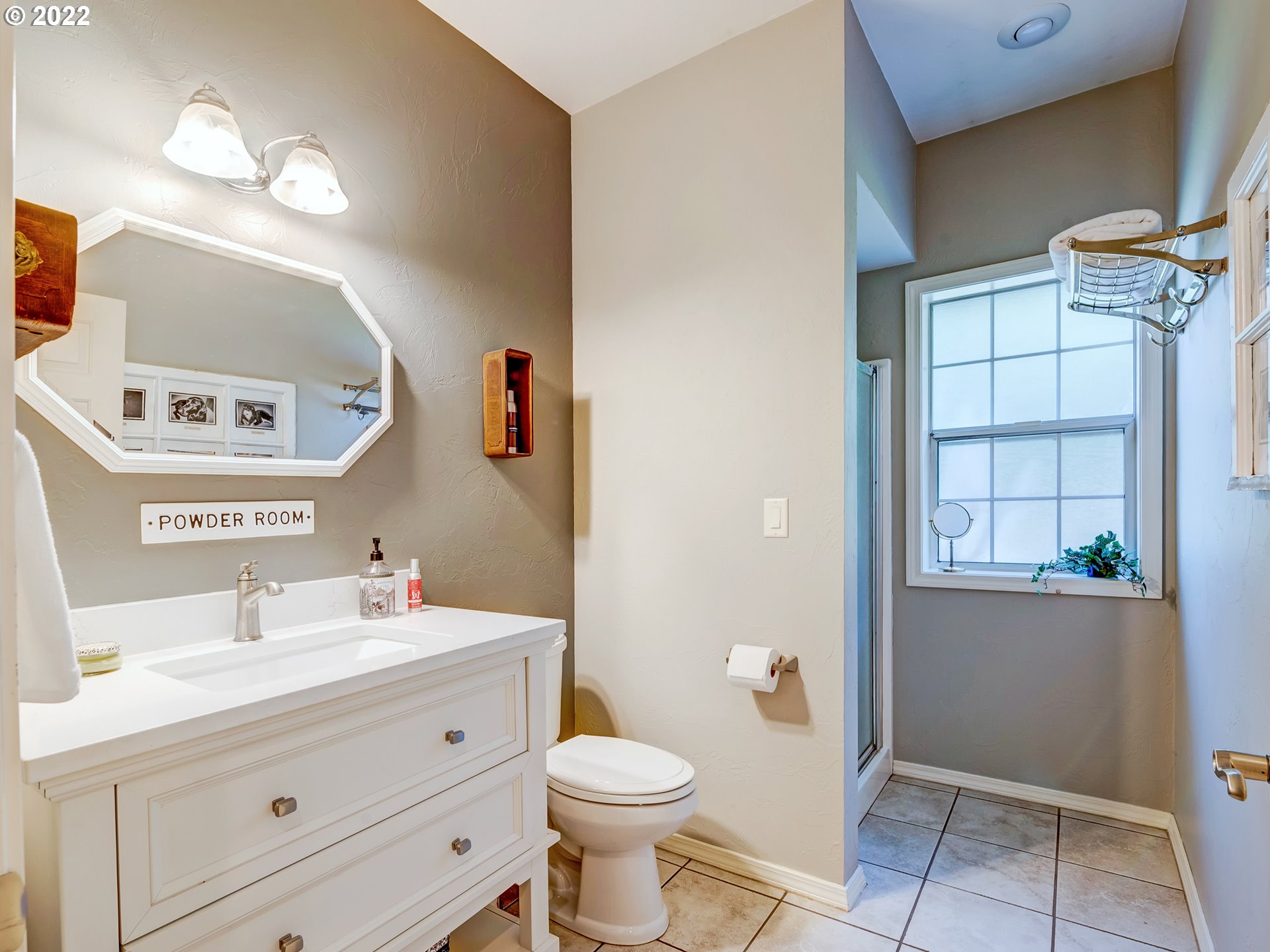 28244 Edgewater Drive Eugene, OR 97402 - Photo 16 of 30 a bathroom with a sink toilet and mirror