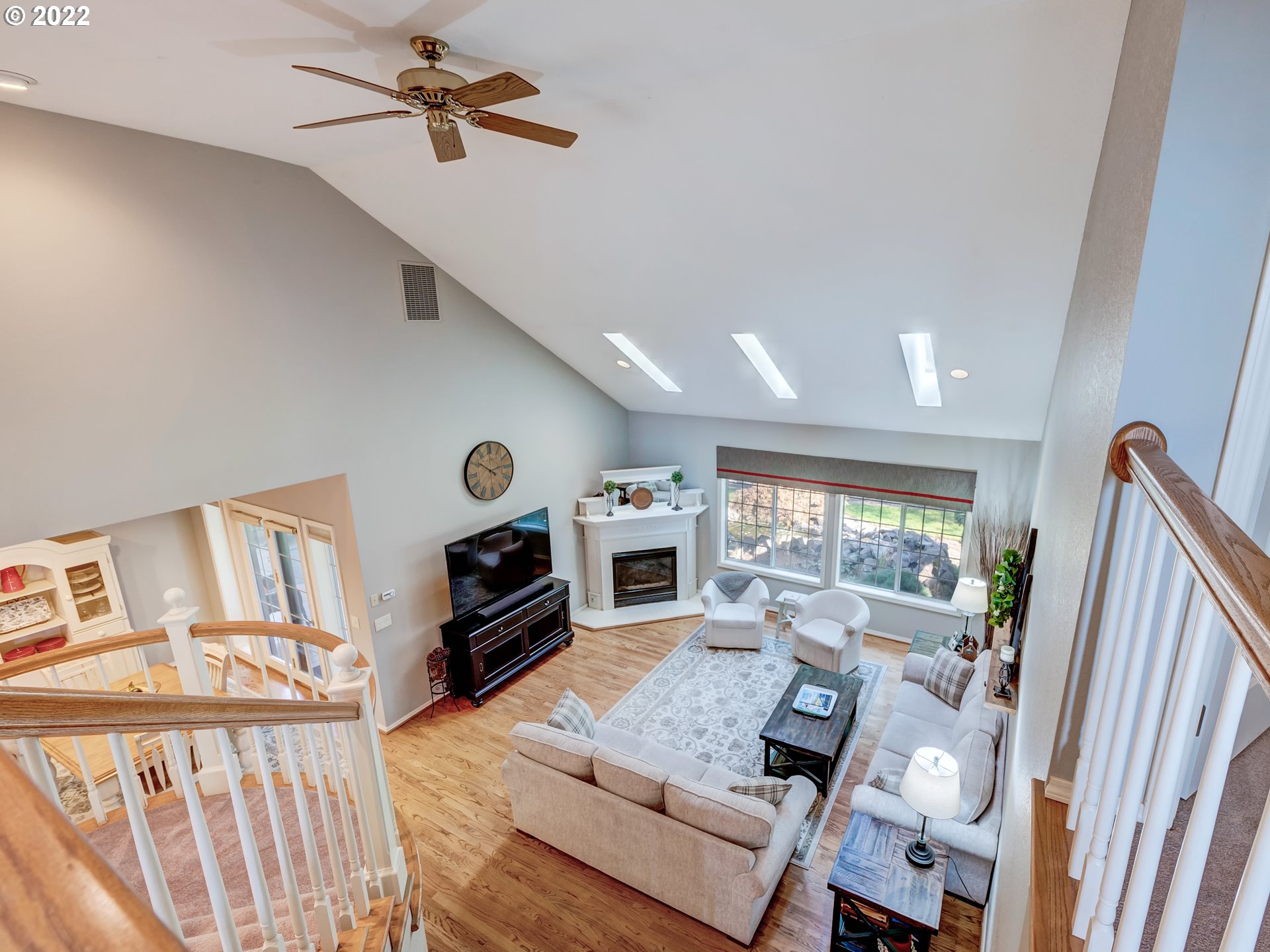 28244 Edgewater Drive Eugene, OR 97402 - Photo 21 of 30 a living room with furniture flat screen tv and a fireplace