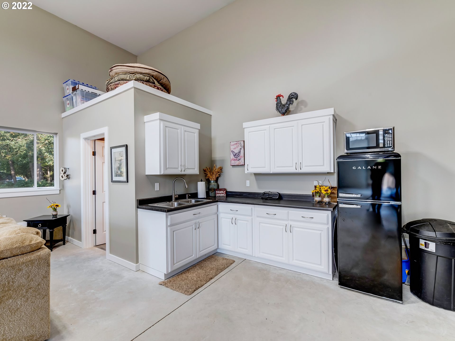 28244 Edgewater Drive Eugene, OR 97402 - Photo 24 of 30 a kitchen with stainless steel appliances granite countertop a stove and a refrigerator