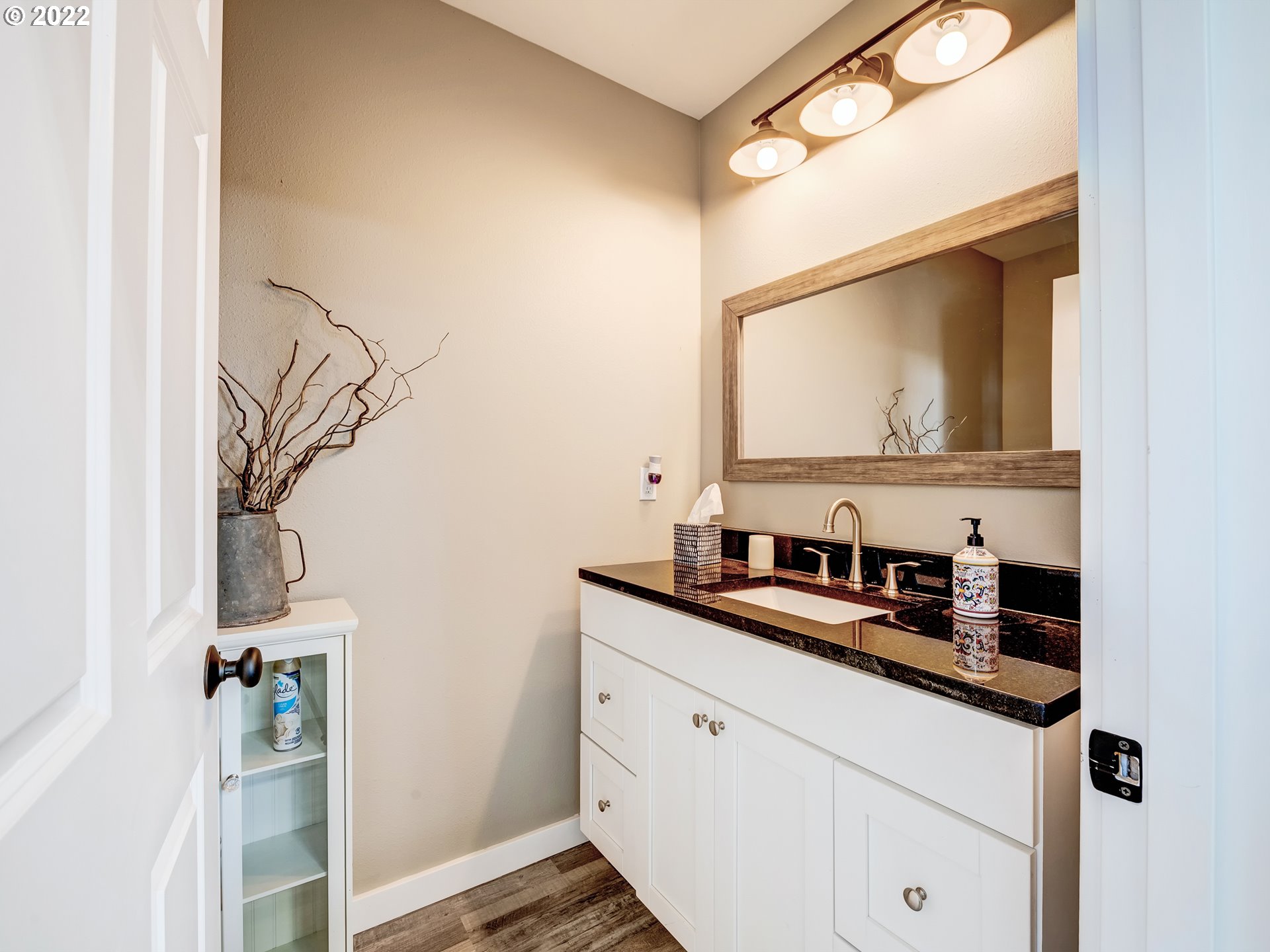 28244 Edgewater Drive Eugene, OR 97402 - Photo 26 of 30 a bathroom with a sink and a mirror
