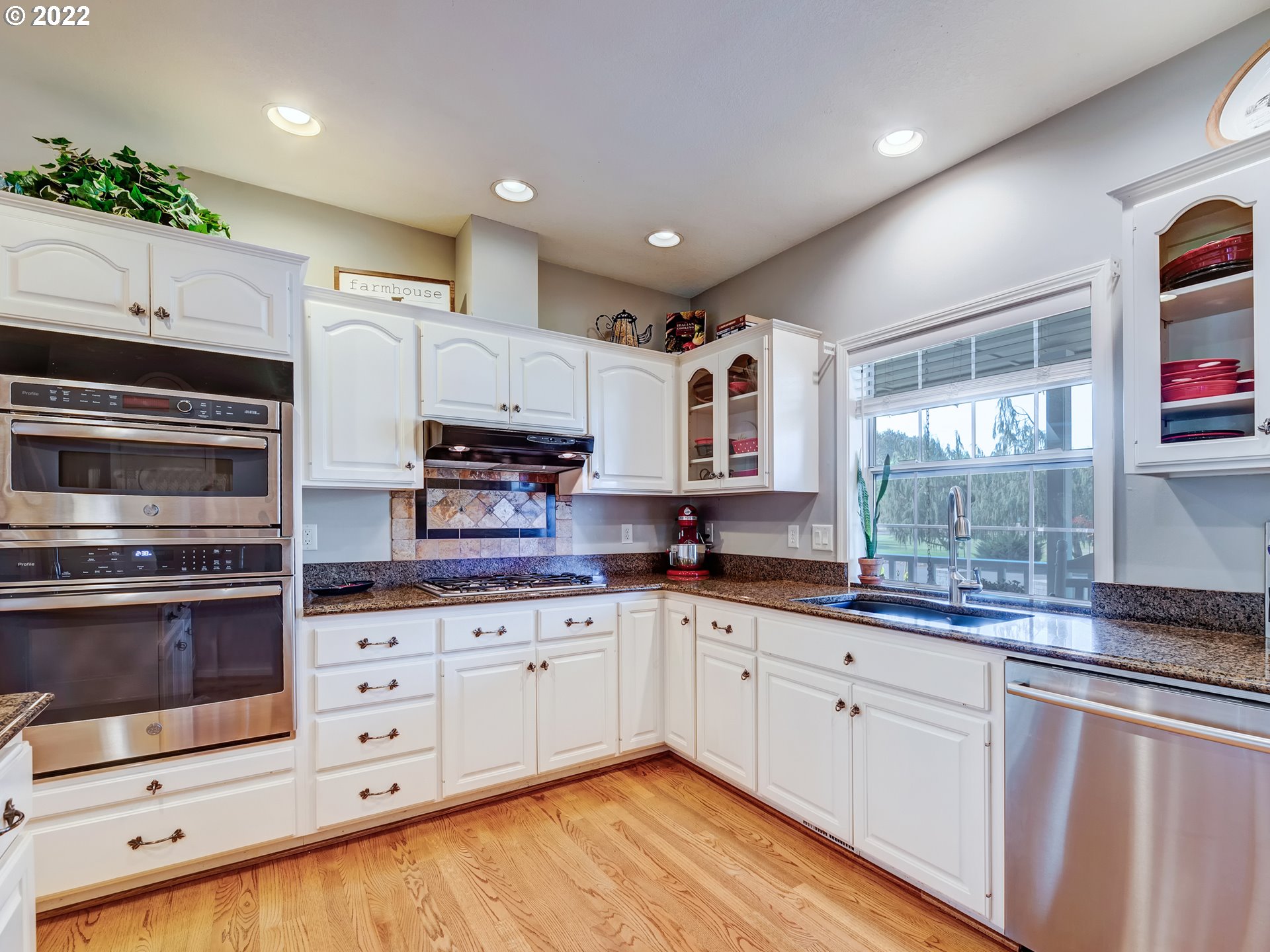 28244 Edgewater Drive Eugene, OR 97402 - Photo 7 of 30 a kitchen with granite countertop a sink stainless steel appliances and cabinets