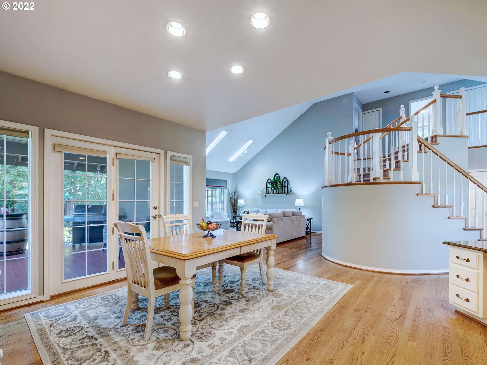28244 Edgewater Drive Eugene, OR 97402 - Photo 8 of 30 a living room with furniture and a dining table with wooden floor