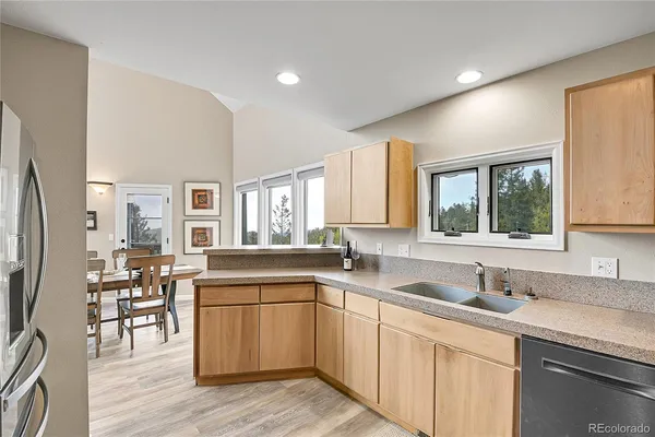 a kitchen with a sink stove and cabinets