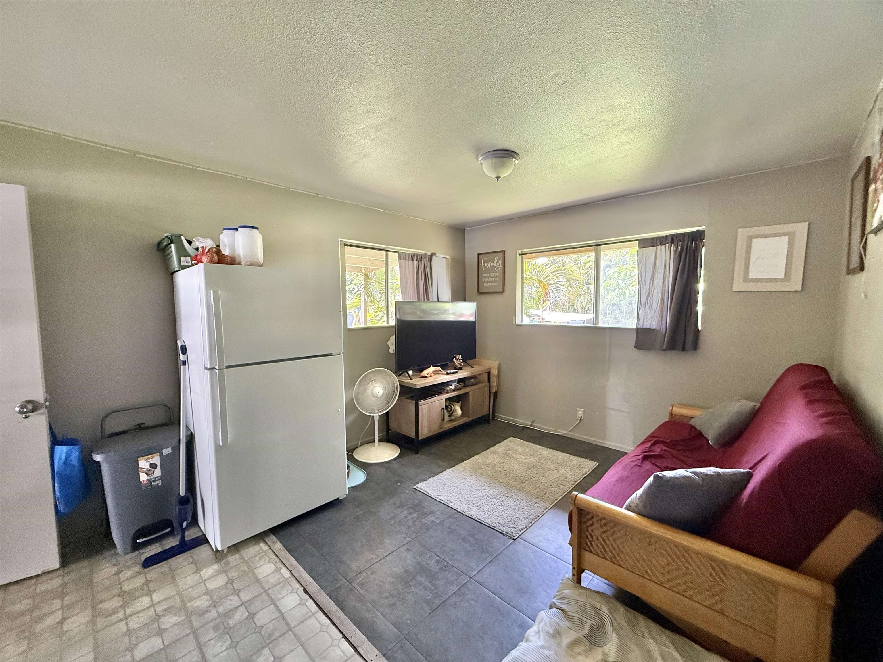 1630 Kauhikoa Road Haiku, HI 96708 - Photo 31 of 48 a living room with furniture and a window