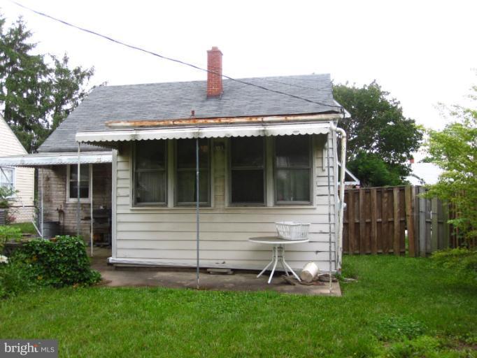 1902 Washington Road Baltimore, MD 21222 - Photo 1 of 18 a front view of house with a garden
