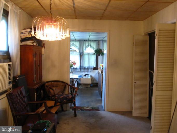1902 Washington Road Baltimore, MD 21222 - Photo 13 of 18 a view of a dining room with furniture and chandelier