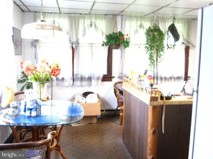 1902 Washington Road Baltimore, MD 21222 - Photo 15 of 18 a view of a dining room with furniture and a potted plant