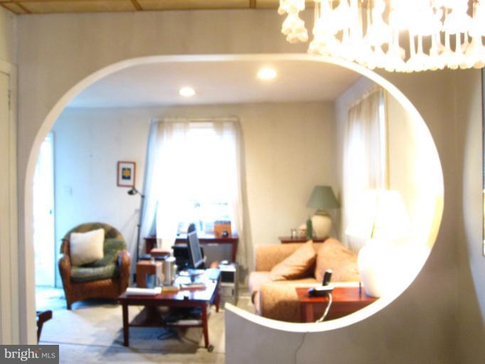 1902 Washington Road Baltimore, MD 21222 - Photo 6 of 18 a living room with furniture and a mirror