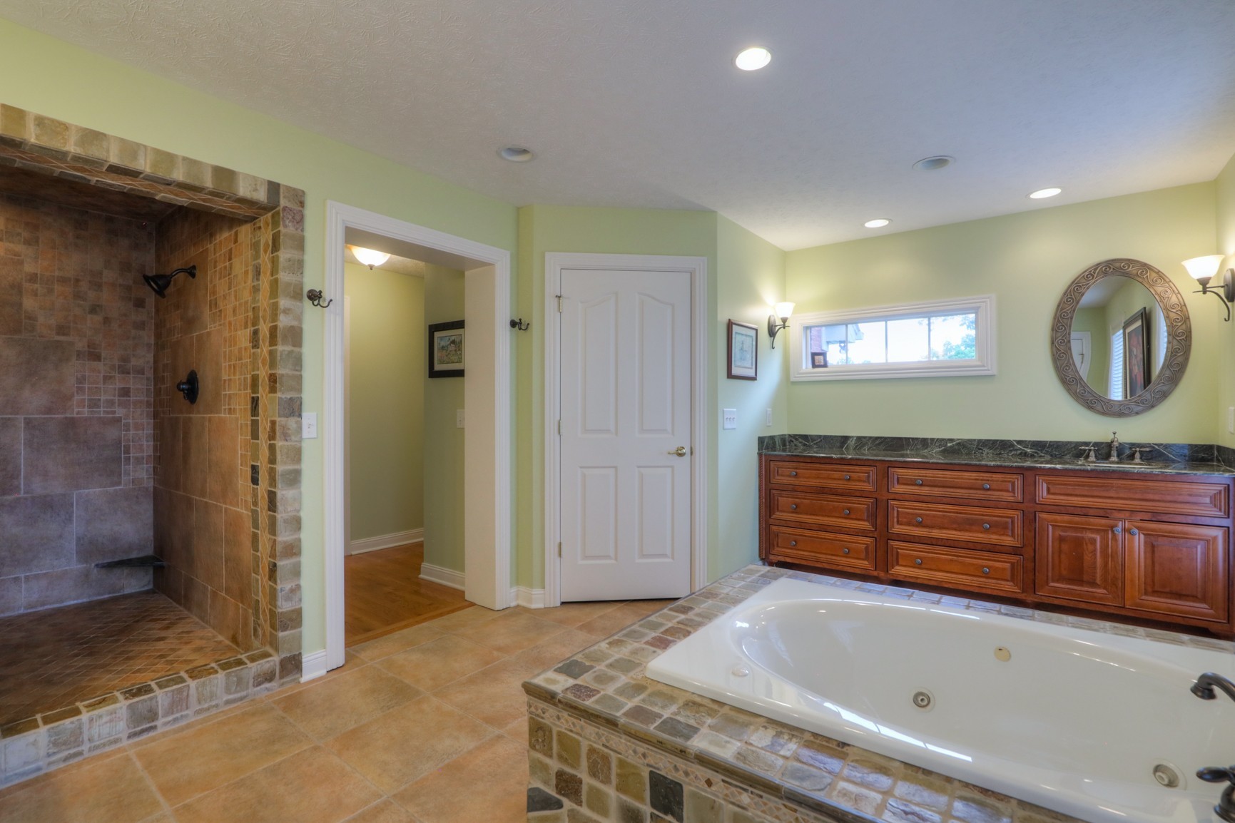505 Bethlehem Road Lebanon, TN 37087 - Photo 15 of 44 a bathroom with a granite countertop sink and a bathtub
