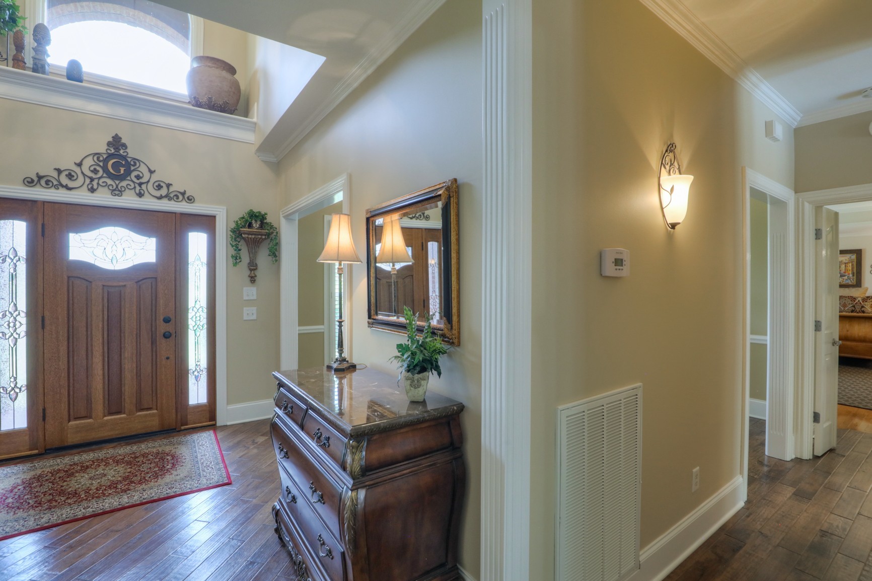 505 Bethlehem Road Lebanon, TN 37087 - Photo 3 of 44 a hallway with wooden floor and a mirror