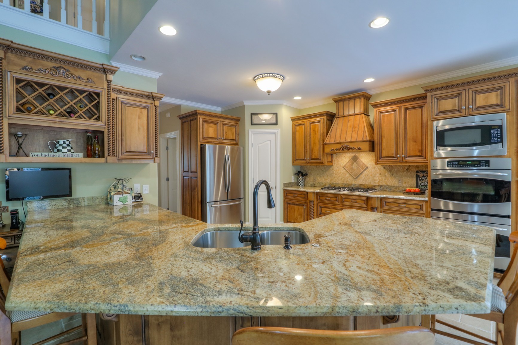 505 Bethlehem Road Lebanon, TN 37087 - Photo 7 of 44 a kitchen with stainless steel appliances granite countertop a sink and a stove