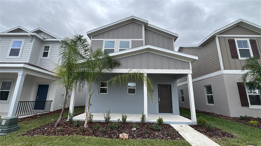6040 Zen Way Clermont, FL 34714 - Photo 1 of 1 a front view of a house with garden