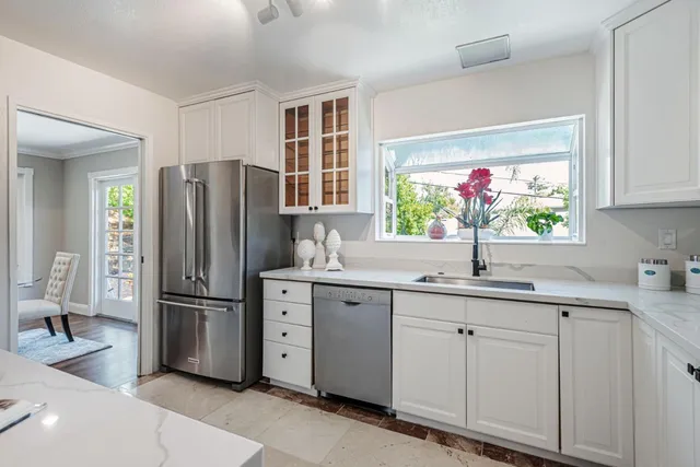 a kitchen with a sink and refrigerator