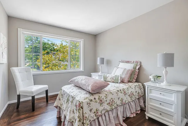 a bedroom with a bed and a chair