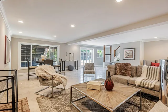 a living room with furniture and a table