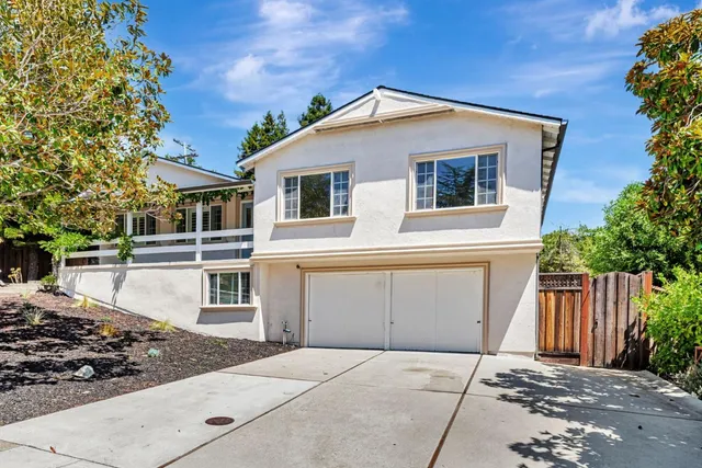 a front view of a house with a garage