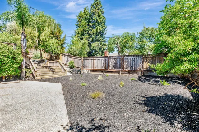 a view of a patio with chairs and tables