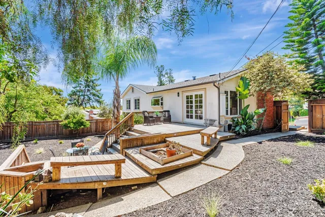 a view of a wooden deck with a bench