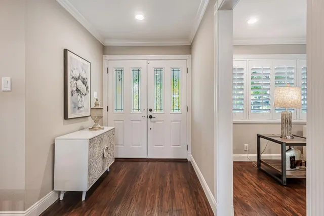 a bathroom with a sink a mirror and a window