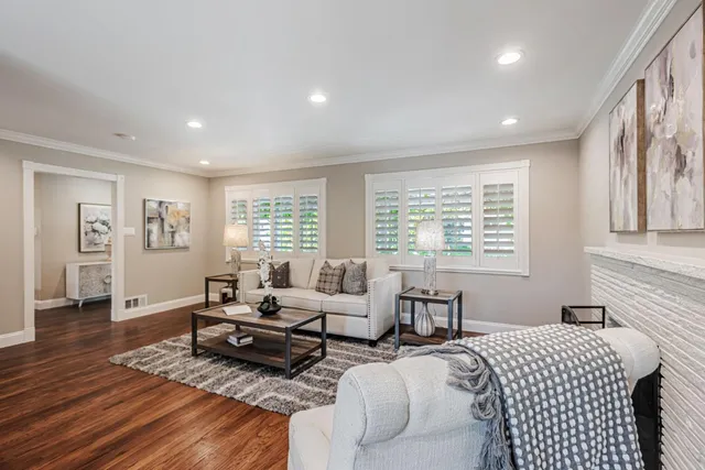 a bedroom with furniture and wooden floor