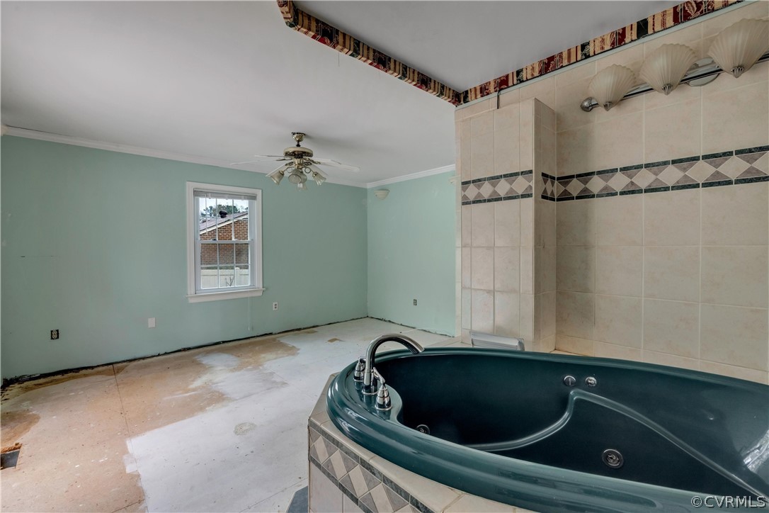 4859 Wedgemere Road Chesterfield, VA 23832 - Photo 11 of 21 a bathroom with a bathtub a window and a shower