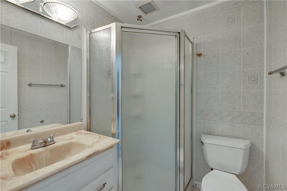4859 Wedgemere Road Chesterfield, VA 23832 - Photo 14 of 21 a bathroom with a sink toilet and shower