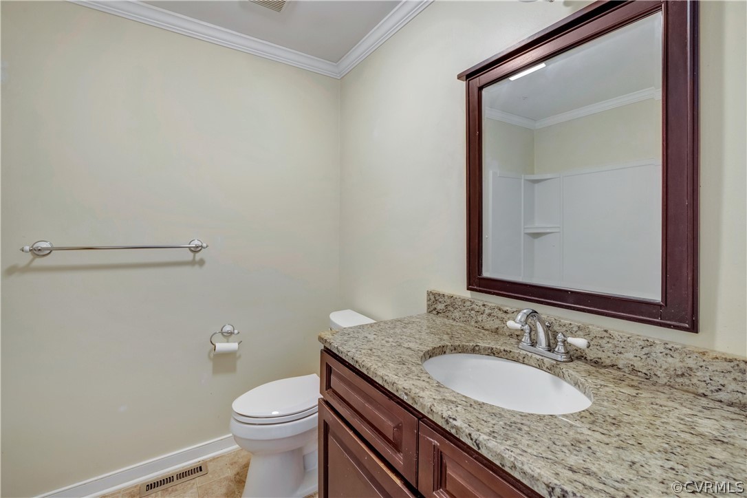 4859 Wedgemere Road Chesterfield, VA 23832 - Photo 15 of 21 a bathroom with a granite countertop sink a toilet and a mirror