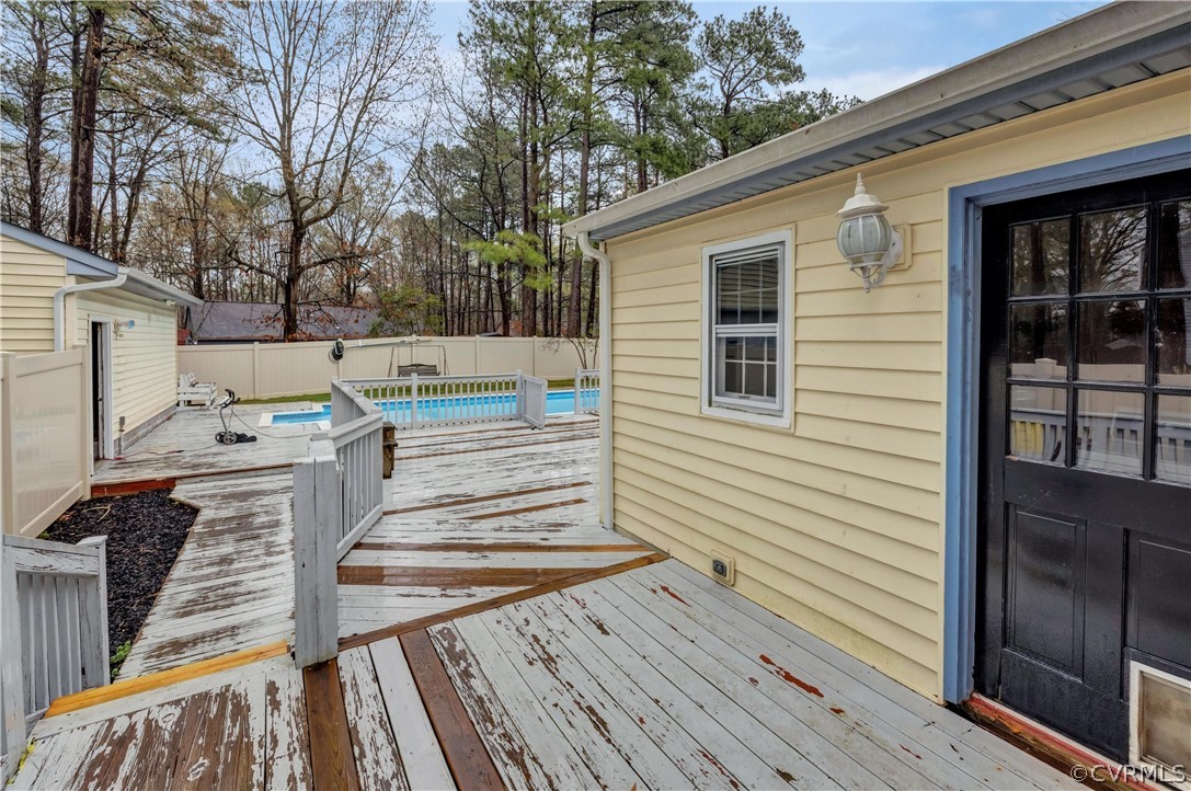 4859 Wedgemere Road Chesterfield, VA 23832 - Photo 18 of 21 a view of a deck with wooden floor and fence next to a yard