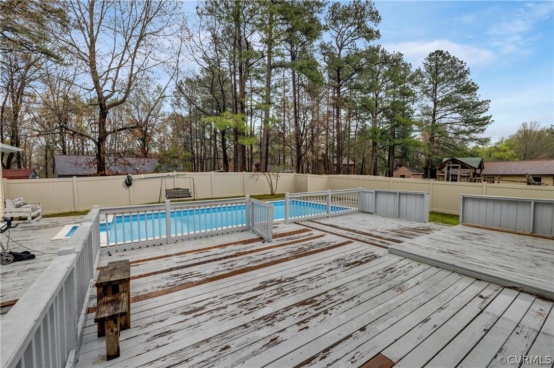 4859 Wedgemere Road Chesterfield, VA 23832 - Photo 19 of 21 a view of backyard with wooden fence and trees