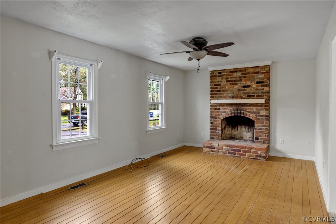 4859 Wedgemere Road Chesterfield, VA 23832 - Photo 3 of 21 a view of an empty room with a fireplace and a window