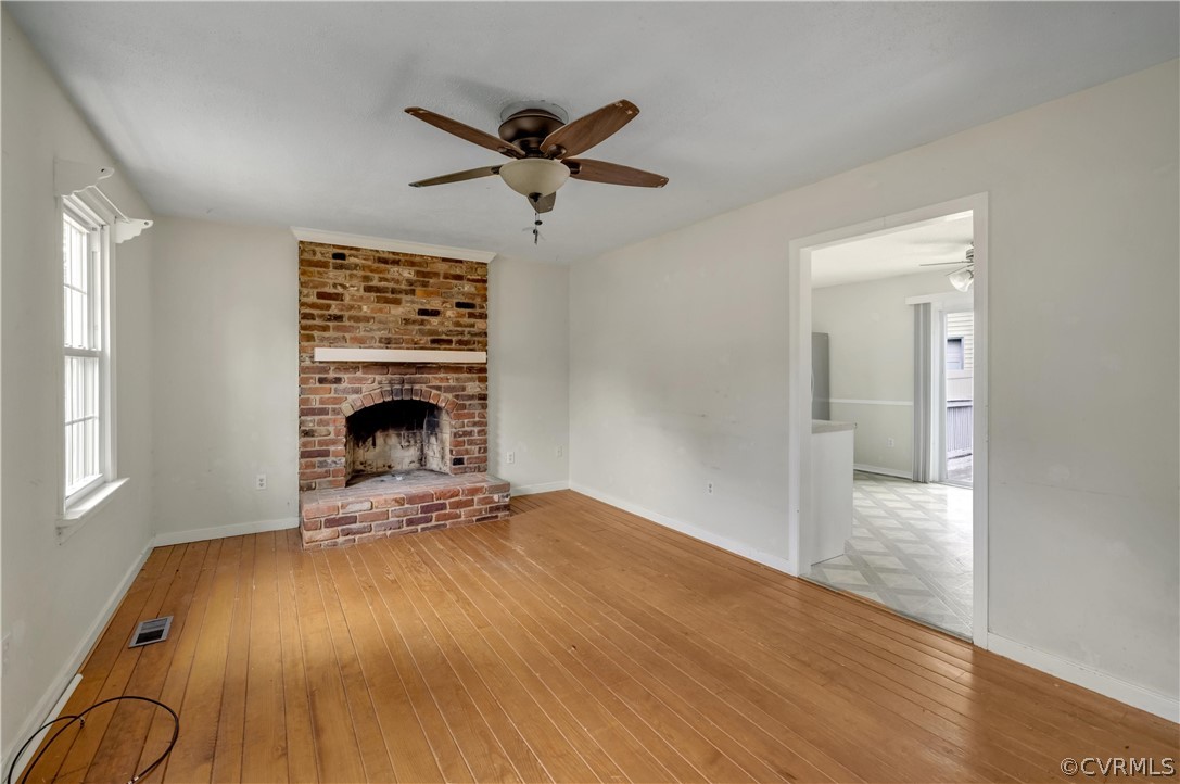 4859 Wedgemere Road Chesterfield, VA 23832 - Photo 4 of 21 an empty room with windows and fireplace