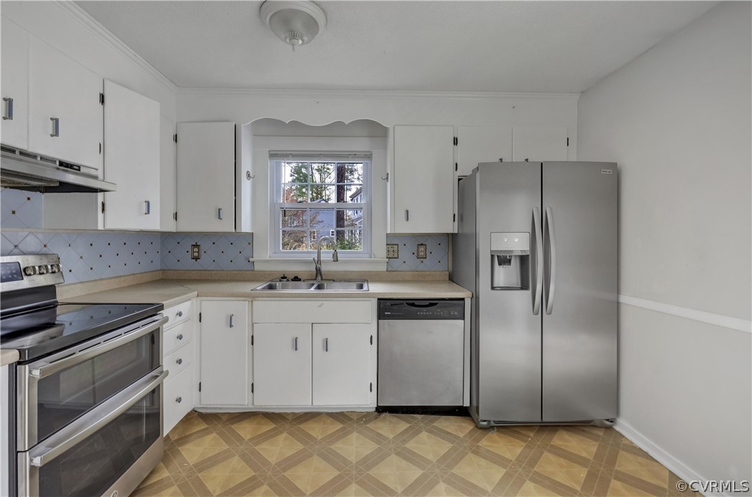 4859 Wedgemere Road Chesterfield, VA 23832 - Photo 8 of 21 a kitchen with stainless steel appliances granite countertop a refrigerator sink and stove