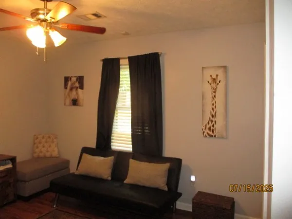 a view of room with window and hallway