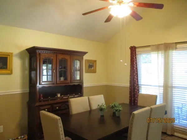 a kitchen with a refrigerator and countertop