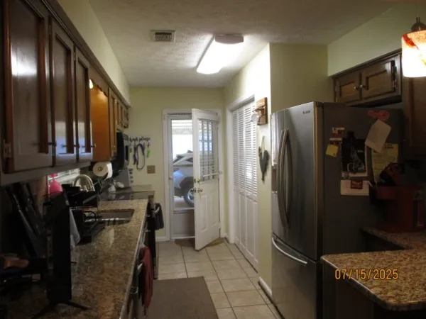 a kitchen with a sink and a stove top oven