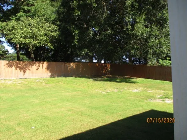 a view of a patio with couches and a table and chairs