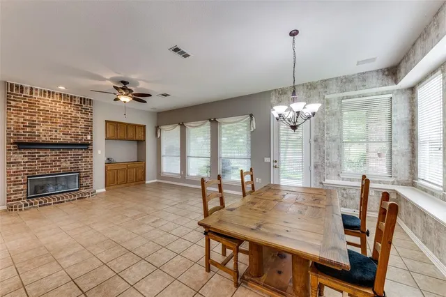 a view of a dining room with furniture window and chandelier