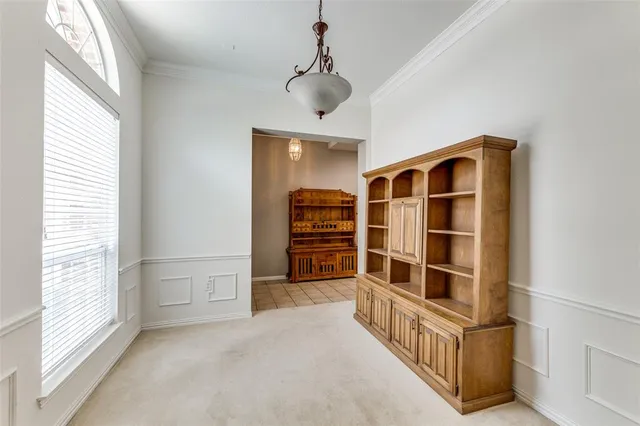 a view of wooden floor and windows in a room
