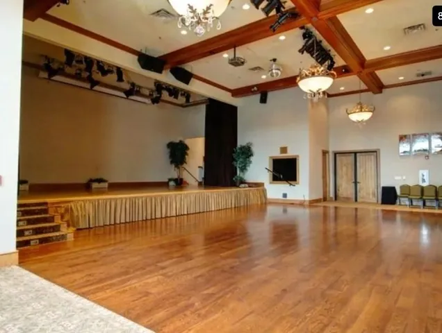 a living room with lots of furniture and large windows