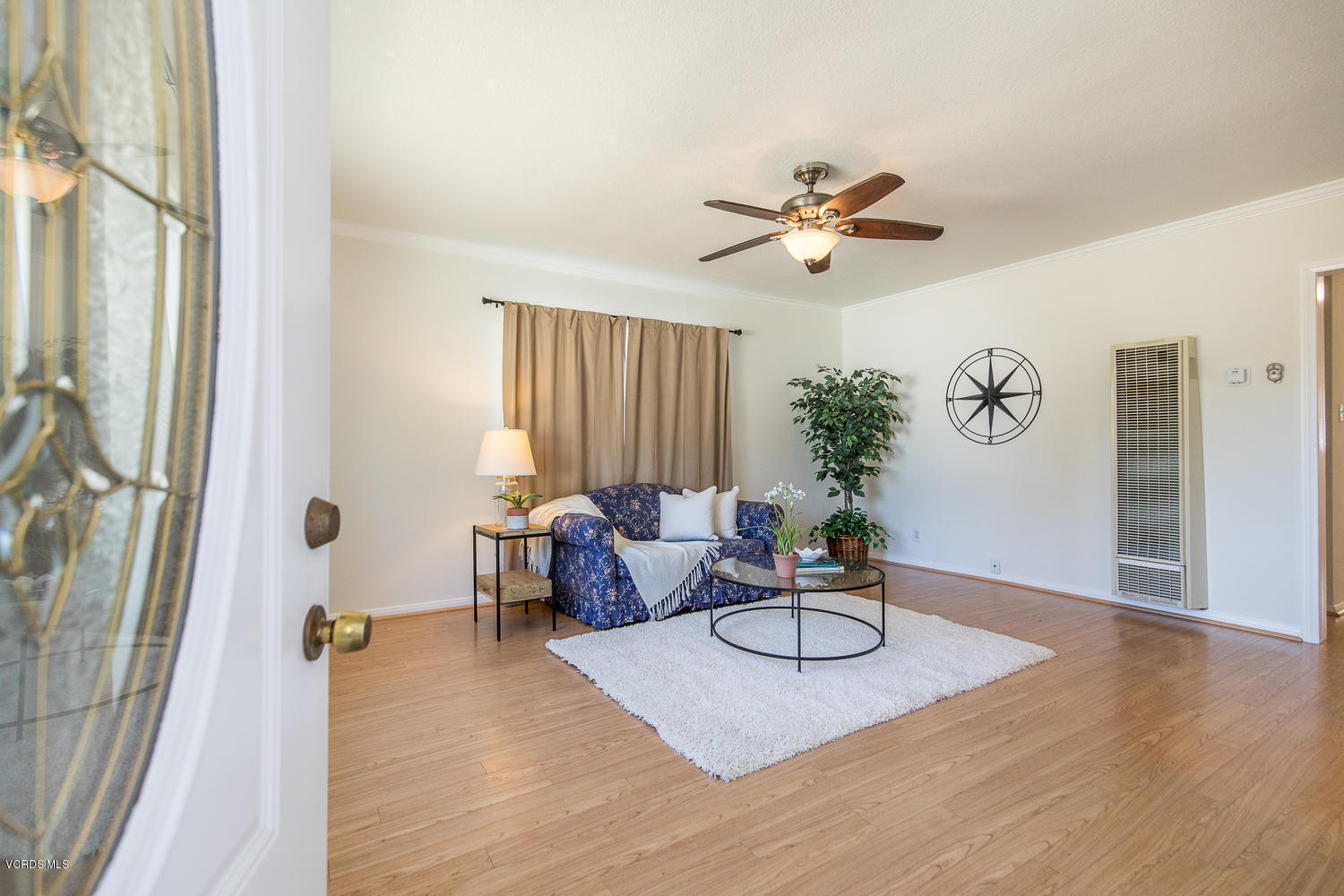 250 Brook Road Newbury Park, CA 91320 - Photo 3 of 18 a living room with furniture gym equipment and a chandelier