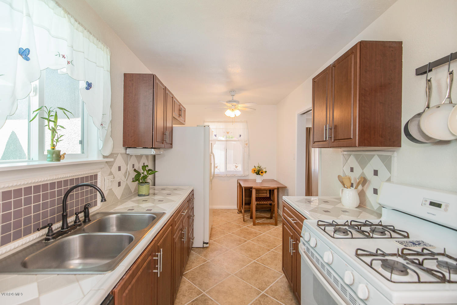 250 Brook Road Newbury Park, CA 91320 - Photo 8 of 18 a kitchen with a stove sink and cabinets