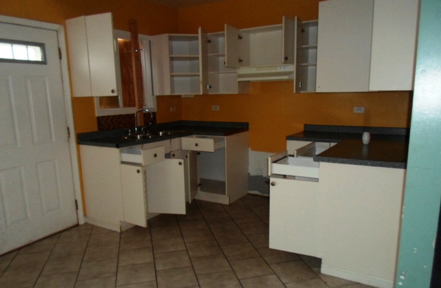 2236 West 47th Place Chicago, IL 60609 - Photo 12 of 18 a room with a washing machine and cabinets