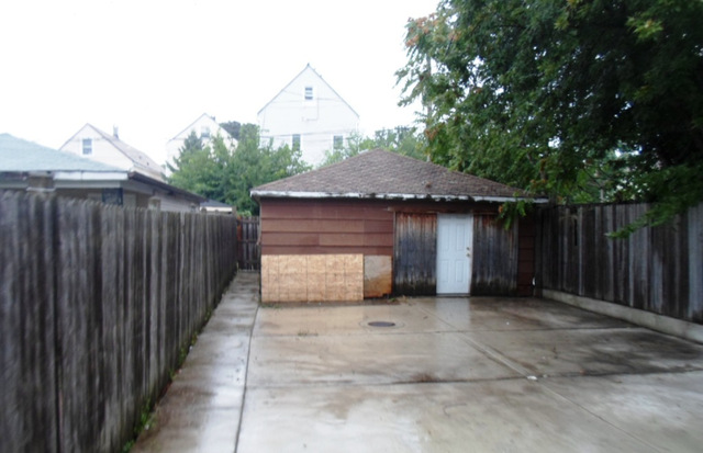 2236 West 47th Place Chicago, IL 60609 - Photo 17 of 18 a front view of a house with a garage